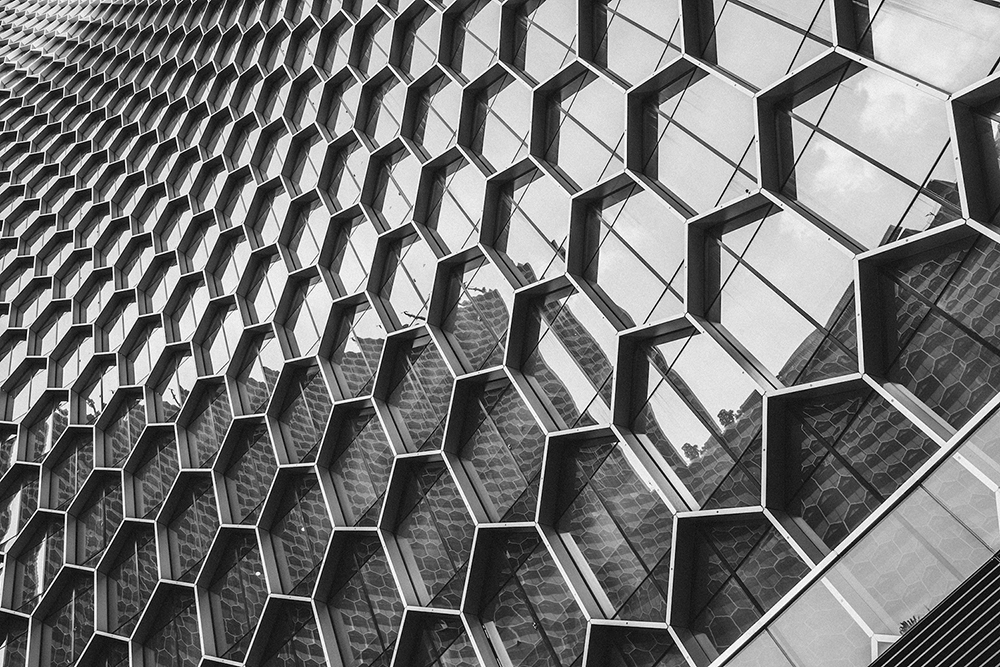 Modern building facade with honeycomb-patterned glass windows